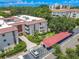 Condo building with parking and lush landscaping at 2612 Pearce Dr # 306, Clearwater, FL 33764