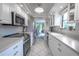 Modern kitchen with white cabinets, stainless steel appliances, and granite countertops at 2612 Pearce Dr # 306, Clearwater, FL 33764