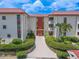 Two-story condo building with red tile roofs at 2612 Pearce Dr # 306, Clearwater, FL 33764