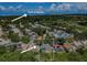 Aerial view of a house near the Gulf of Mexico, showcasing a neighborhood setting at 957 Westwinds Blvd, Tarpon Springs, FL 34689