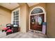 Elegant double-door entry with stained glass and a welcoming porch at 957 Westwinds Blvd, Tarpon Springs, FL 34689