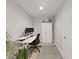 Bright home office with standing desk, monitor, and storage at 920 N Osceola Ave # 201, Clearwater, FL 33755