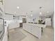 Modern kitchen with white cabinets, stainless steel appliances, and island at 920 N Osceola Ave # 201, Clearwater, FL 33755