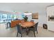 Live edge dining table with seating for four, open to kitchen at 920 N Osceola Ave # 201, Clearwater, FL 33755
