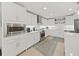 White shaker cabinets, stainless steel appliances, and a large island at 920 N Osceola Ave # 201, Clearwater, FL 33755