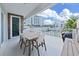 Private balcony with table and chairs, offering water views at 920 N Osceola Ave # 201, Clearwater, FL 33755