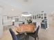 Live edge wood dining table with gray chairs near kitchen at 920 N Osceola Ave # 201, Clearwater, FL 33755