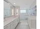 Elegant bathroom featuring a double vanity and a walk-in shower at 920 N Osceola Ave # 201, Clearwater, FL 33755