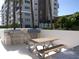 Outdoor grilling area with stainless steel grills and picnic tables at 920 N Osceola Ave # 201, Clearwater, FL 33755