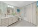 Clean bathroom with white vanity, bathtub, and shower at 920 N Osceola Ave # 201, Clearwater, FL 33755
