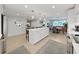 Modern kitchen features white cabinets, stainless steel appliances, and breakfast bar at 920 N Osceola Ave # 201, Clearwater, FL 33755