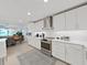 Modern kitchen with white cabinets and stainless steel appliances at 920 N Osceola Ave # 201, Clearwater, FL 33755
