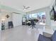 Home office with standing desk, wall-mounted shelves, and water view at 920 N Osceola Ave # 201, Clearwater, FL 33755