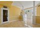 Built-in wine cellar with glass door, located in the entryway at 1768 Lago Vista, Palm Harbor, FL 34685