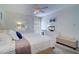 Main bedroom with king-size bed, dresser, and ceiling fan at 1655 S Highland Ave # B216, Clearwater, FL 33756