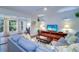 Bright living room featuring hardwood floors and a cozy sectional sofa at 1655 S Highland Ave # B216, Clearwater, FL 33756