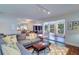 Open living room with hardwood floors, sectional sofa, and views at 1655 S Highland Ave # B216, Clearwater, FL 33756