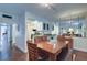 Dining area with wood table and chairs, adjacent to kitchen at 1655 S Highland Ave # B216, Clearwater, FL 33756