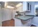 Modern kitchen with stainless steel appliances and wood cabinets at 1655 S Highland Ave # B216, Clearwater, FL 33756