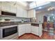 Kitchen with stainless steel appliances and white cabinetry at 1655 S Highland Ave # B216, Clearwater, FL 33756