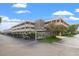 Exterior view of the apartment building and parking area at 5080 Locust Ne St # 329, St Petersburg, FL 33703