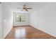 Simple bedroom with wood flooring and ceiling fan at 5080 Locust Ne St # 329, St Petersburg, FL 33703