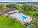 Community pool with patio area and lush landscaping at 5080 Locust Ne St # 329, St Petersburg, FL 33703