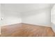 Living room with hardwood floors and access to kitchen at 5080 Locust Ne St # 329, St Petersburg, FL 33703