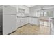 White kitchen with gray countertops, stainless steel appliances, and tile floor at 5080 Locust Ne St # 329, St Petersburg, FL 33703