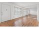 Living room with hardwood floors and large mirror at 5080 Locust Ne St # 329, St Petersburg, FL 33703