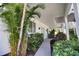 Inviting entryway with lush landscaping and a paved pathway at 13064 Via Flavia, Placida, FL 33946