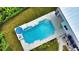 Stunning aerial view of a modern, geometric pool and spa at 13064 Via Flavia, Placida, FL 33946