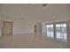 Spacious living area with tile flooring and large windows at 13064 Via Flavia, Placida, FL 33946