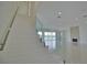 Elegant staircase with glass railing and modern design at 13064 Via Flavia, Placida, FL 33946