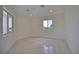 Simple bedroom with tile floors and a window view at 13064 Via Flavia, Placida, FL 33946