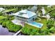 Waterfront property featuring a spacious home, private dock, and inviting pool at 13064 Via Flavia, Placida, FL 33946