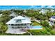 Luxury waterfront home boasting a private pool and expansive backyard at 13064 Via Flavia, Placida, FL 33946