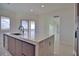 Modern kitchen island with waterfall edge and sink at 13064 Via Flavia, Placida, FL 33946