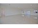 Large living room with tile floors and access to outdoor space at 13064 Via Flavia, Placida, FL 33946