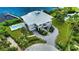 Waterfront home with circular driveway, private pool, and stunning water views at 13064 Via Flavia, Placida, FL 33946