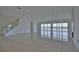 Open living room with water views and fireplace at 13064 Via Flavia, Placida, FL 33946