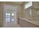 Double vanity bathroom with a view of a waterside room at 13064 Via Flavia, Placida, FL 33946