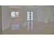Spacious living area with large glass doors and shiny floors at 13064 Via Flavia, Placida, FL 33946