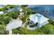 Luxury waterfront home with circular driveway and private dock at 13064 Via Flavia, Placida, FL 33946