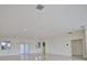 Open concept living room featuring tile floors and multiple windows at 13064 Via Flavia, Placida, FL 33946
