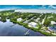 Luxury waterfront property with private dock, pool, and lush landscaping at 13064 Via Flavia, Placida, FL 33946
