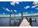 Covered boat lift and spacious dock on calm water at 13064 Via Flavia, Placida, FL 33946