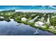 Waterfront home showcasing a private dock, pool, and serene surroundings at 13064 Via Flavia, Placida, FL 33946