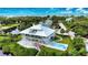 Two-story waterfront home with pool and private dock, offering stunning water views at 13064 Via Flavia, Placida, FL 33946