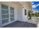Private deck with modern glass doors and water views at 13064 Via Flavia, Placida, FL 33946